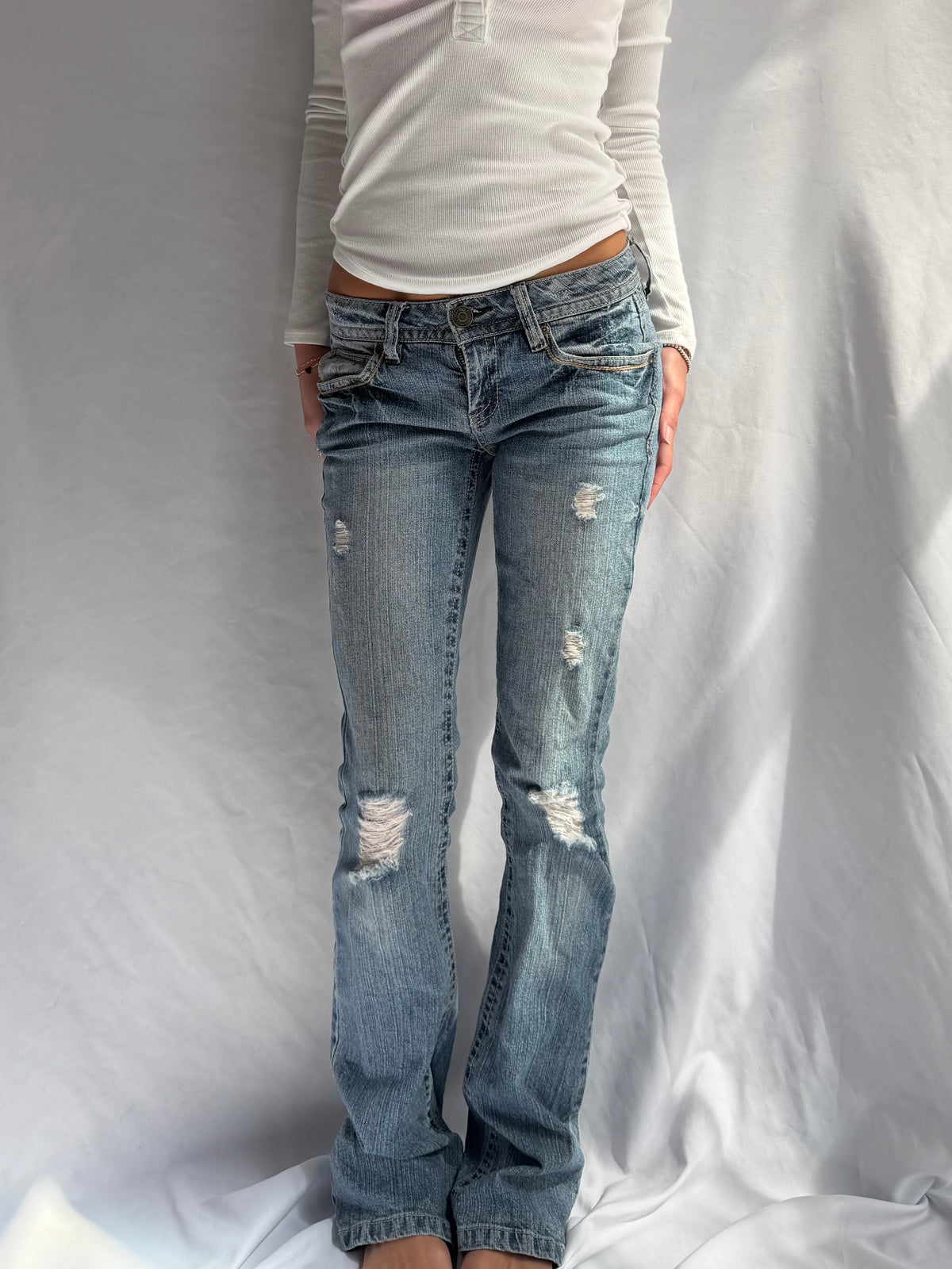 Vintage low rise bootcut ripped jeans